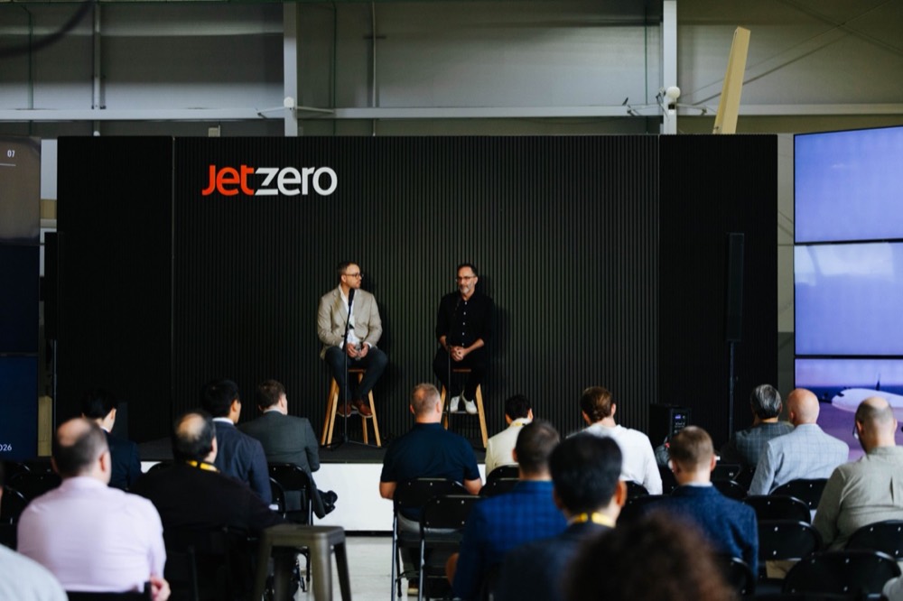 A fireside conversation on stage under the JetZero sign