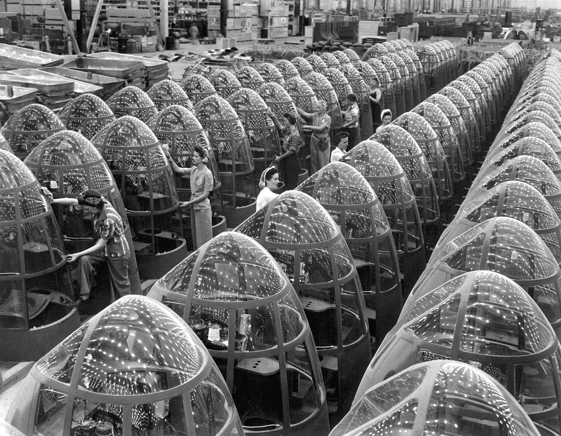 Rows of clear plexiglass bomber noses on the factory floor at Douglas Aircraft's Long Beach plant, 1942